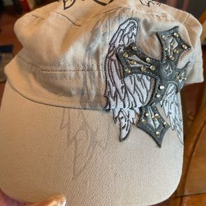 Cap with cross and wings